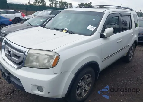 2010 Honda Pilot Touring z USA, uszkodzony, nr VIN 5FNYF4H80AB001882